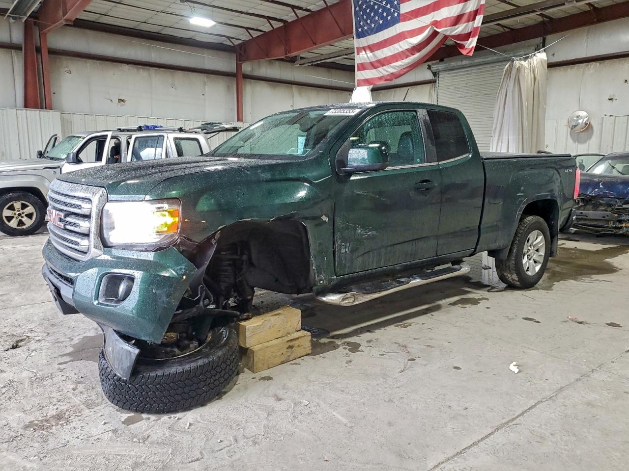 2015 GMC Canyon 4WD SLE, VIN 1GTH6BEA2F1154937 — Front end