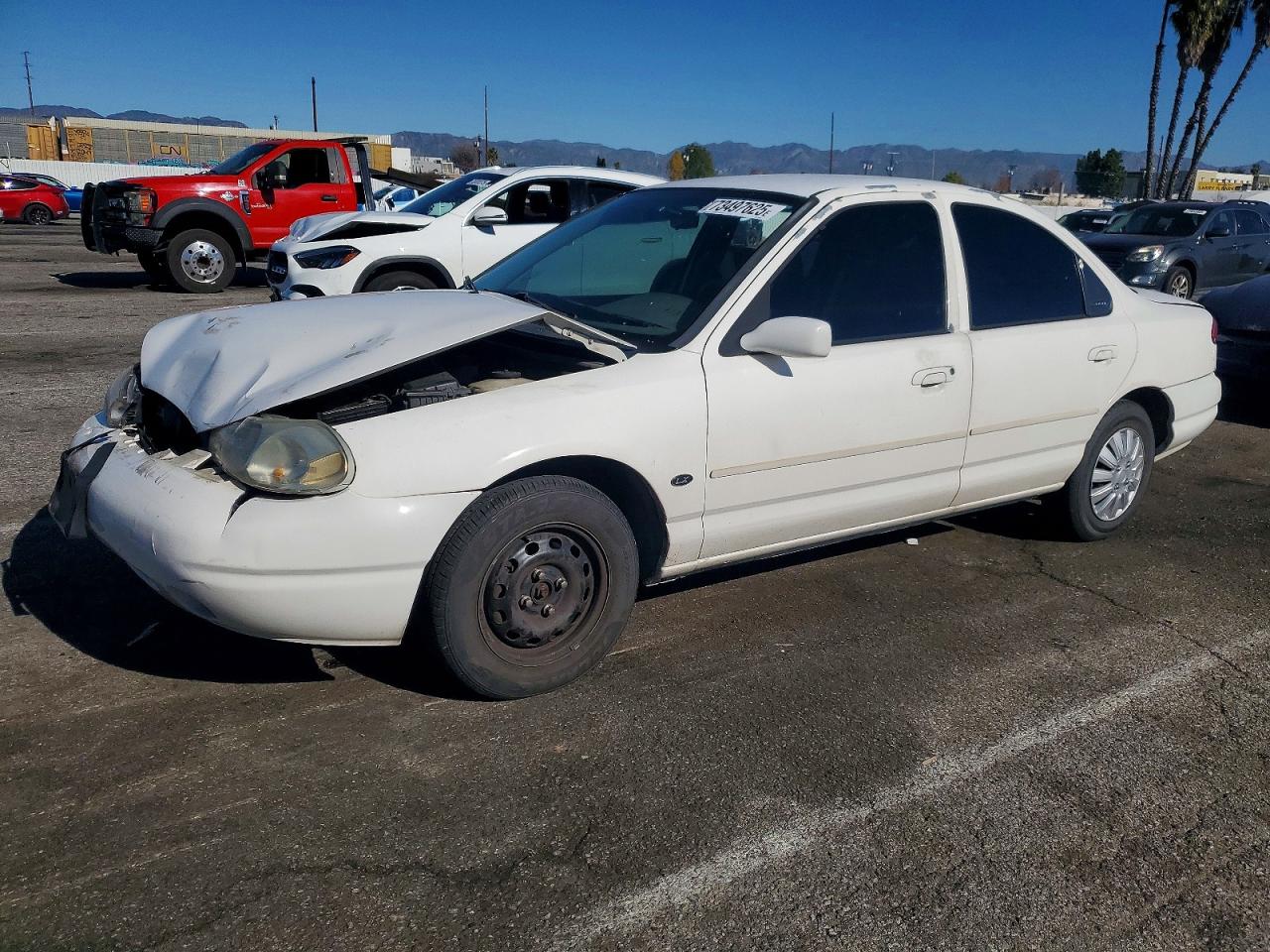 1999 Ford Contour LX, VIN 1FAFP6531XK182565 — Front end