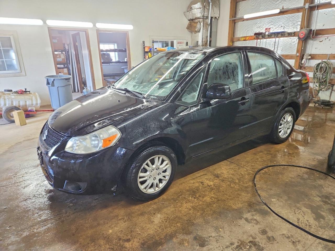 2012 Suzuki SX4 LE, VIN JS2YC5A39C6304080 — Side