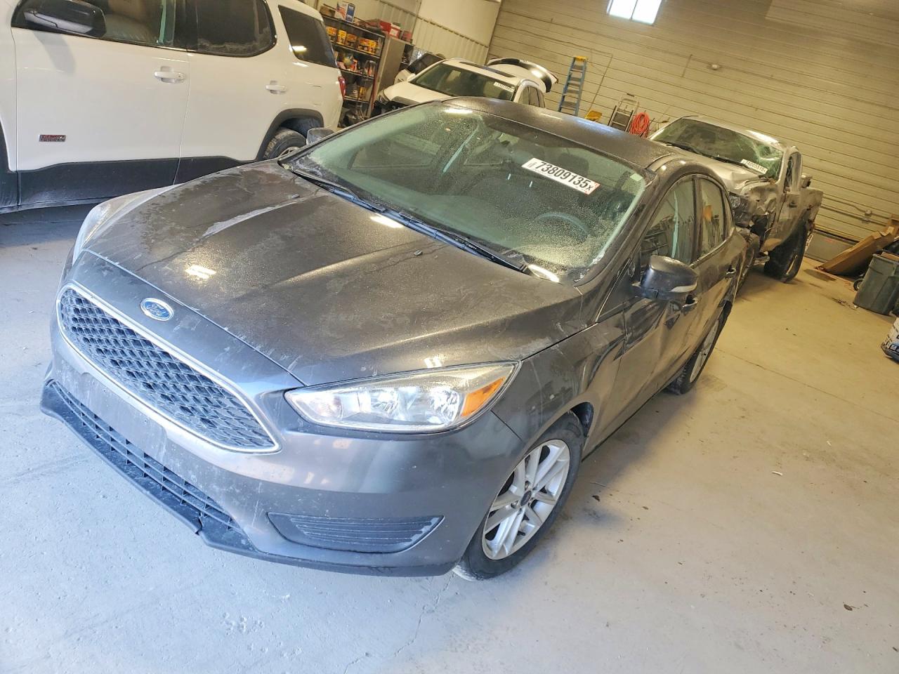 2016 Ford Focus SE, VIN 1FADP3F29GL220095 — Side