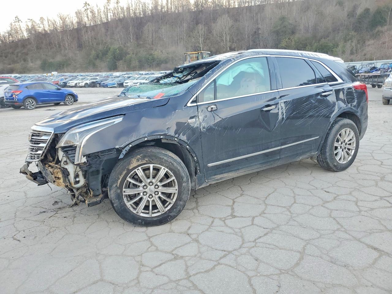 2017 Cadillac XT5 FWD, VIN 1GYKNARS1HZ148230 — Rollover