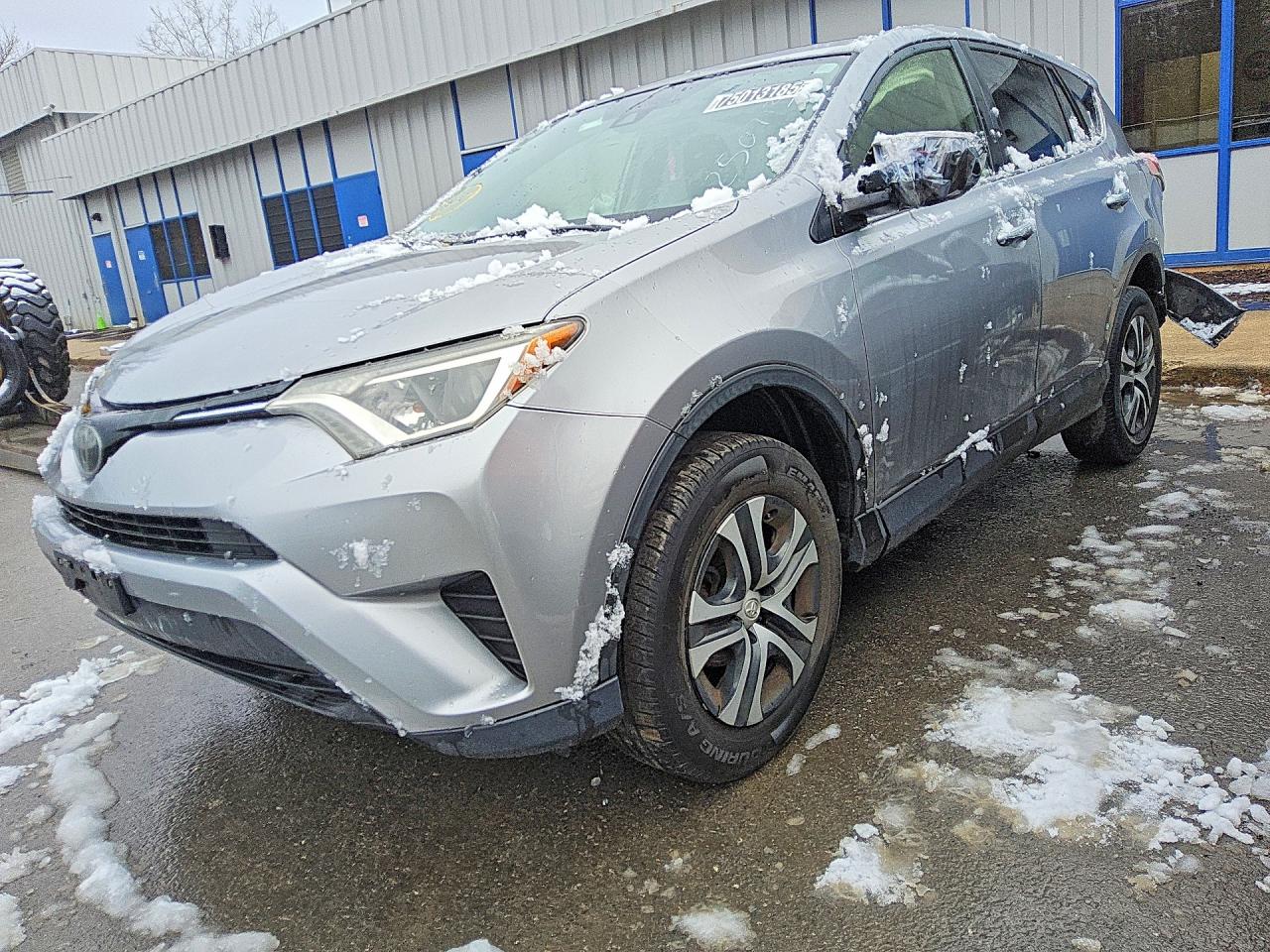 2018 Toyota RAV4 LE, VIN JTMBFREVXJD250713 — Rear end