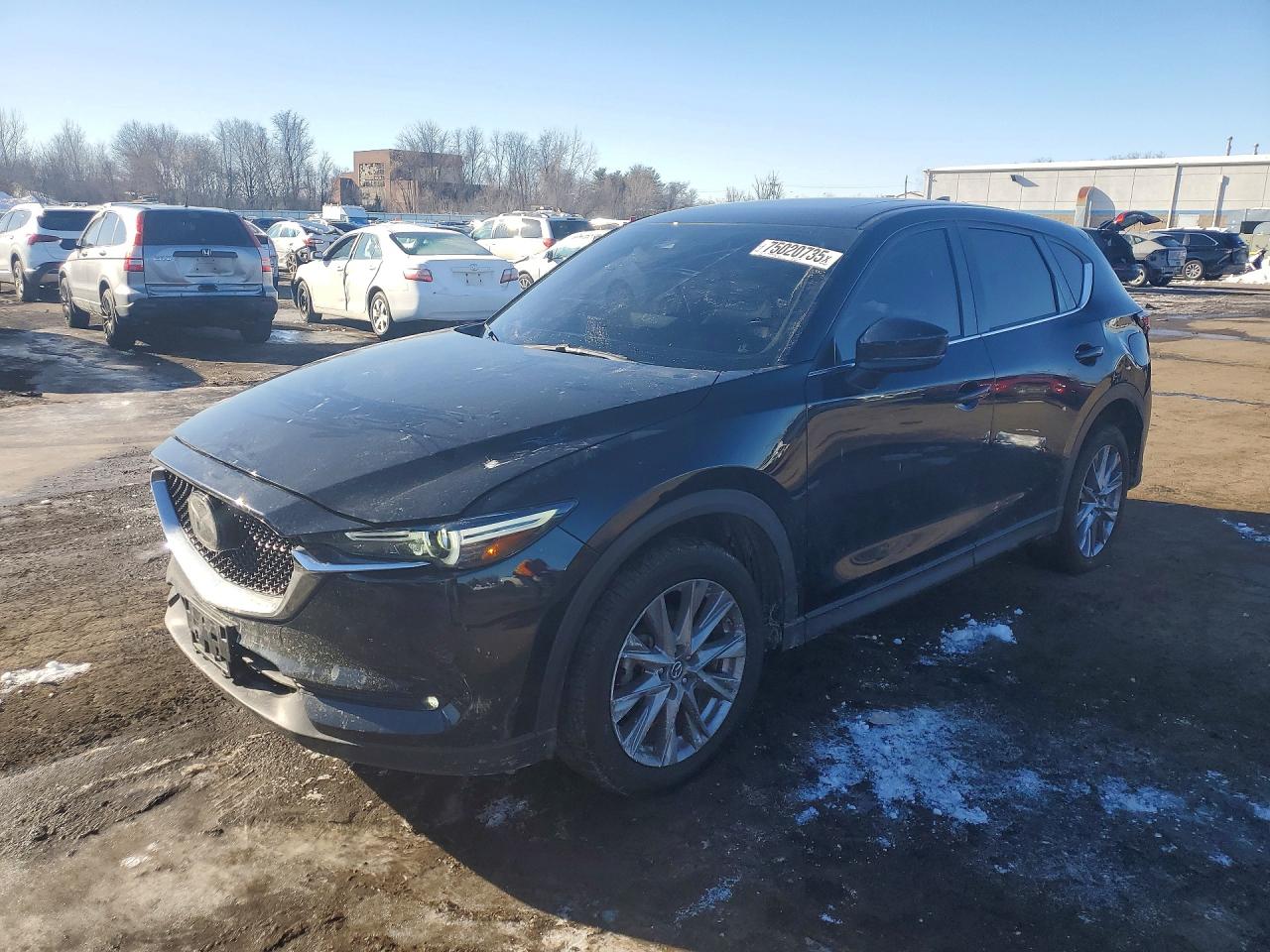 2021 Mazda CX-5 Grand Touring, VIN JM3KFBDM8M0403298 — Side