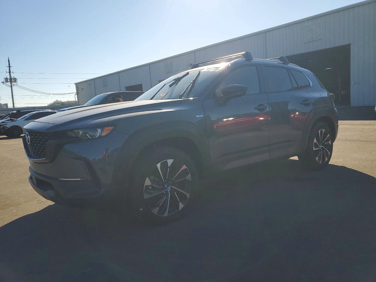 2025 Mazda CX-50 Hybrid Premium Plus Package, VIN 7MMVAAEW3SN136151 — Side