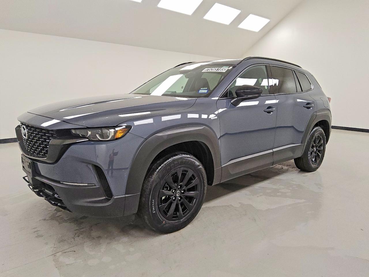 2025 Mazda CX-50 Hybrid Premium Package, VIN 7MMVAADW9SN130212 — Water / flood