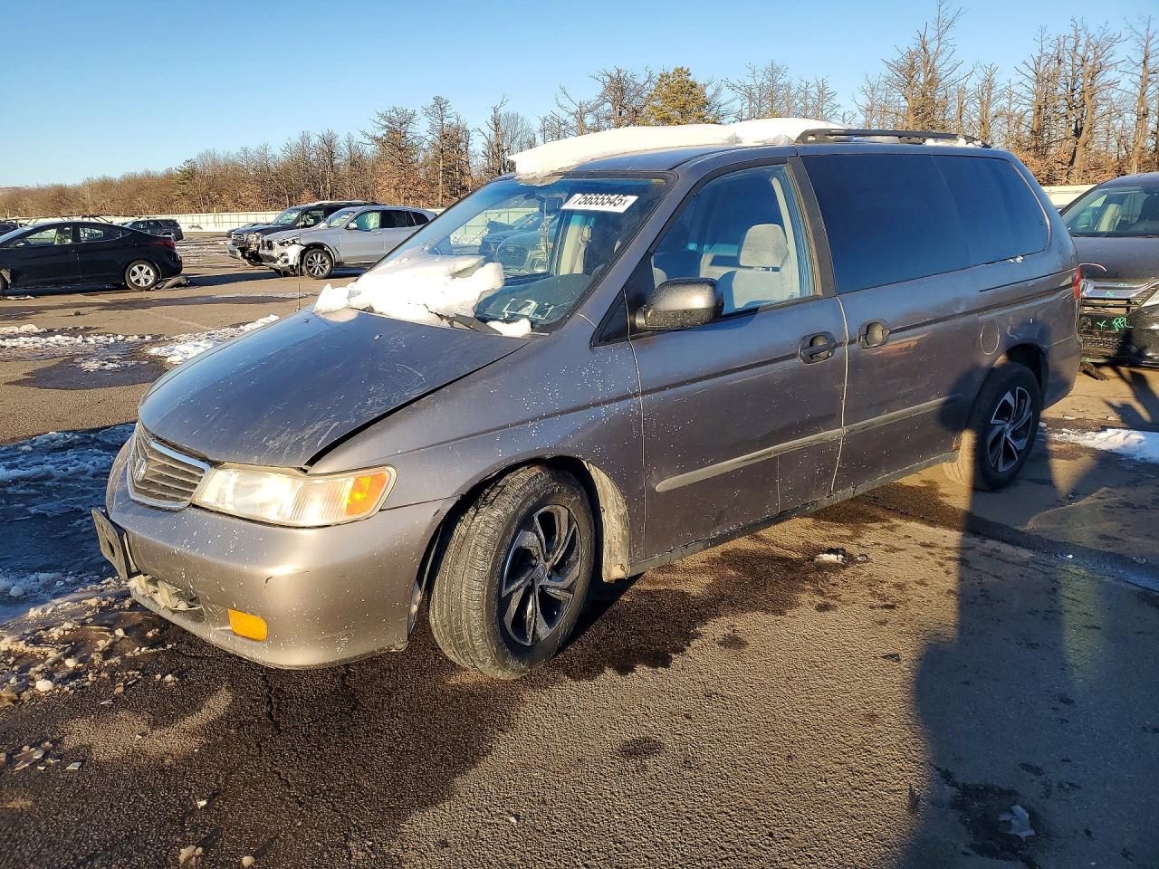1999 Honda Odyssey LX, VIN 2HKRL1850XH548873 — Side