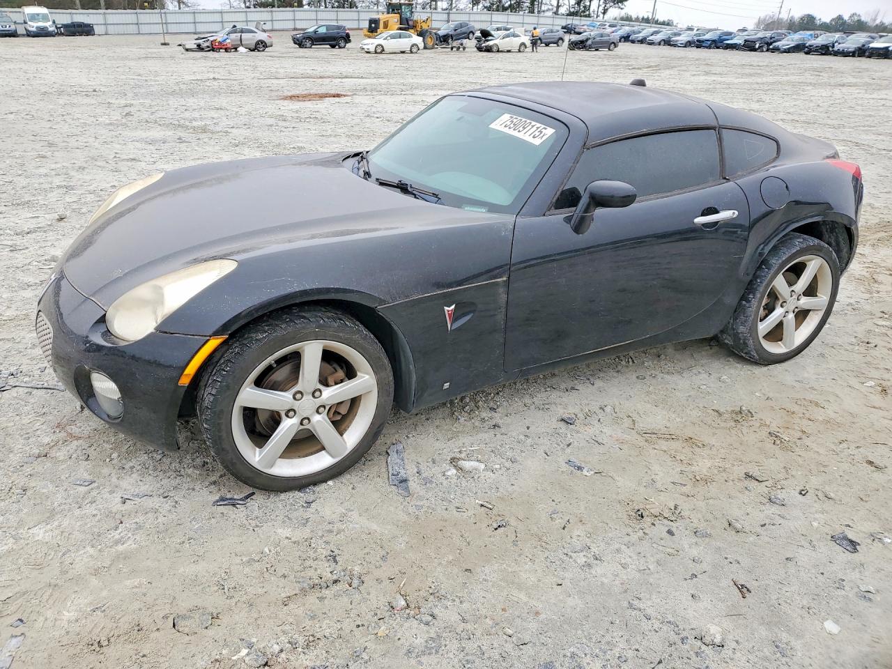 2009 Pontiac Solstice, VIN 1G2MN25B29Y107255 — Side