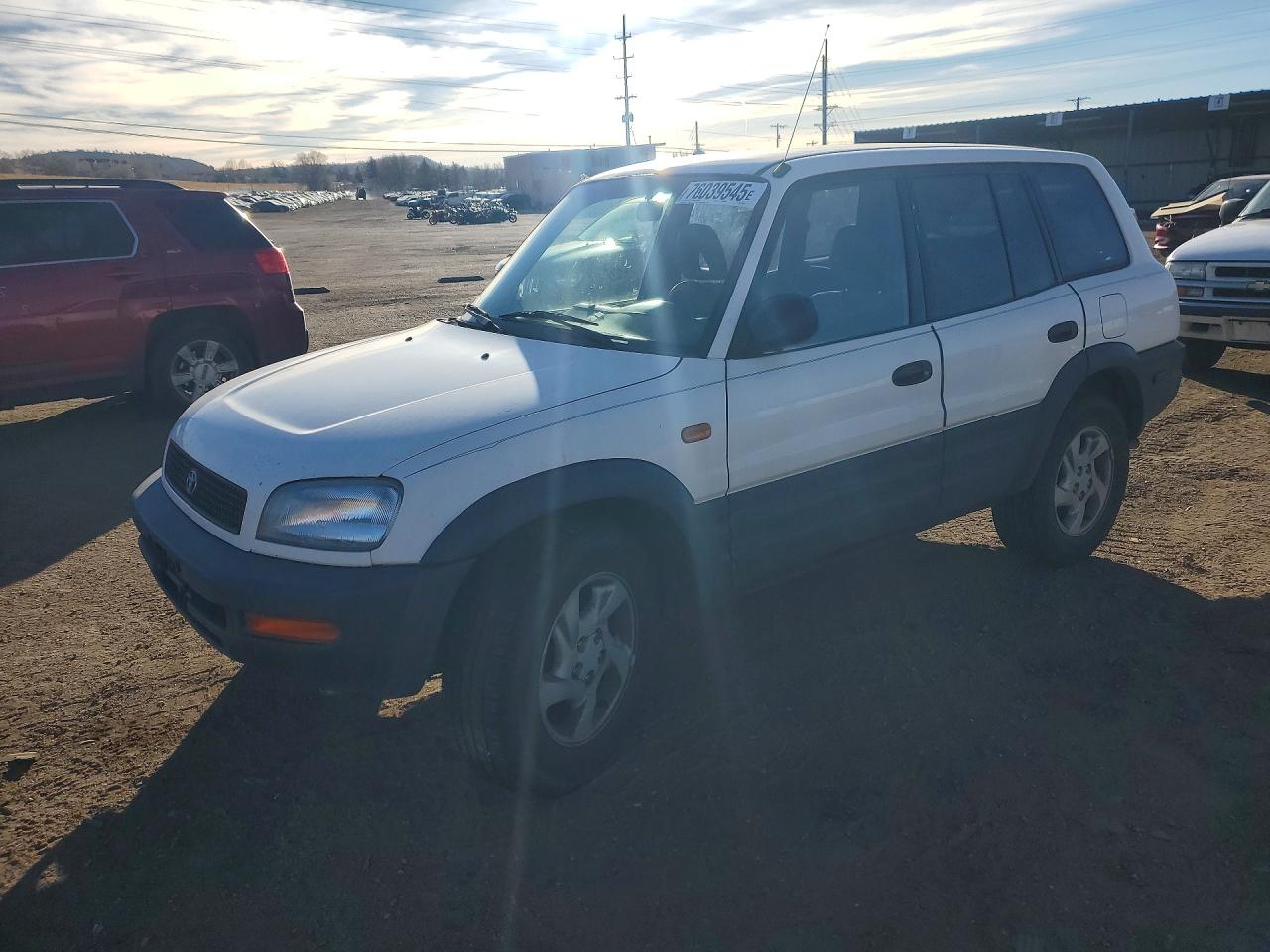 1997 Toyota RAV4, VIN JT3HP10V9V0124277 — Side
