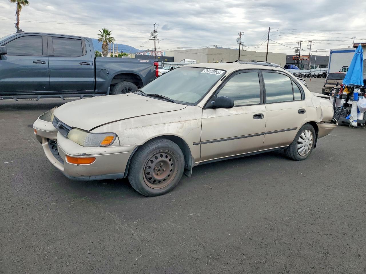 1995 Toyota Corolla DX, VIN 1NXAE09B3SZ302092 — Front end