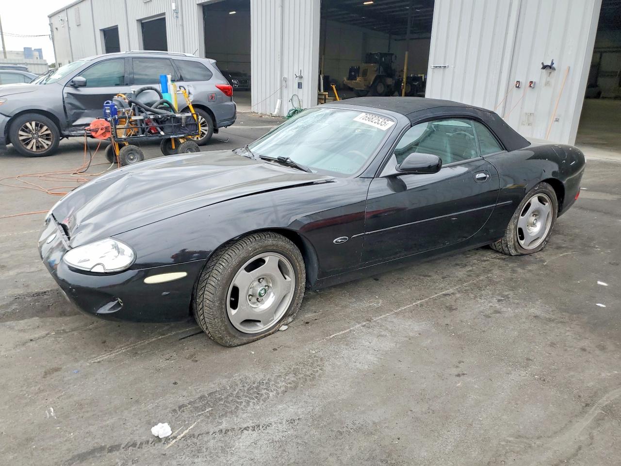1999 Jaguar XK, VIN SAJGX2041XC035598 — Side