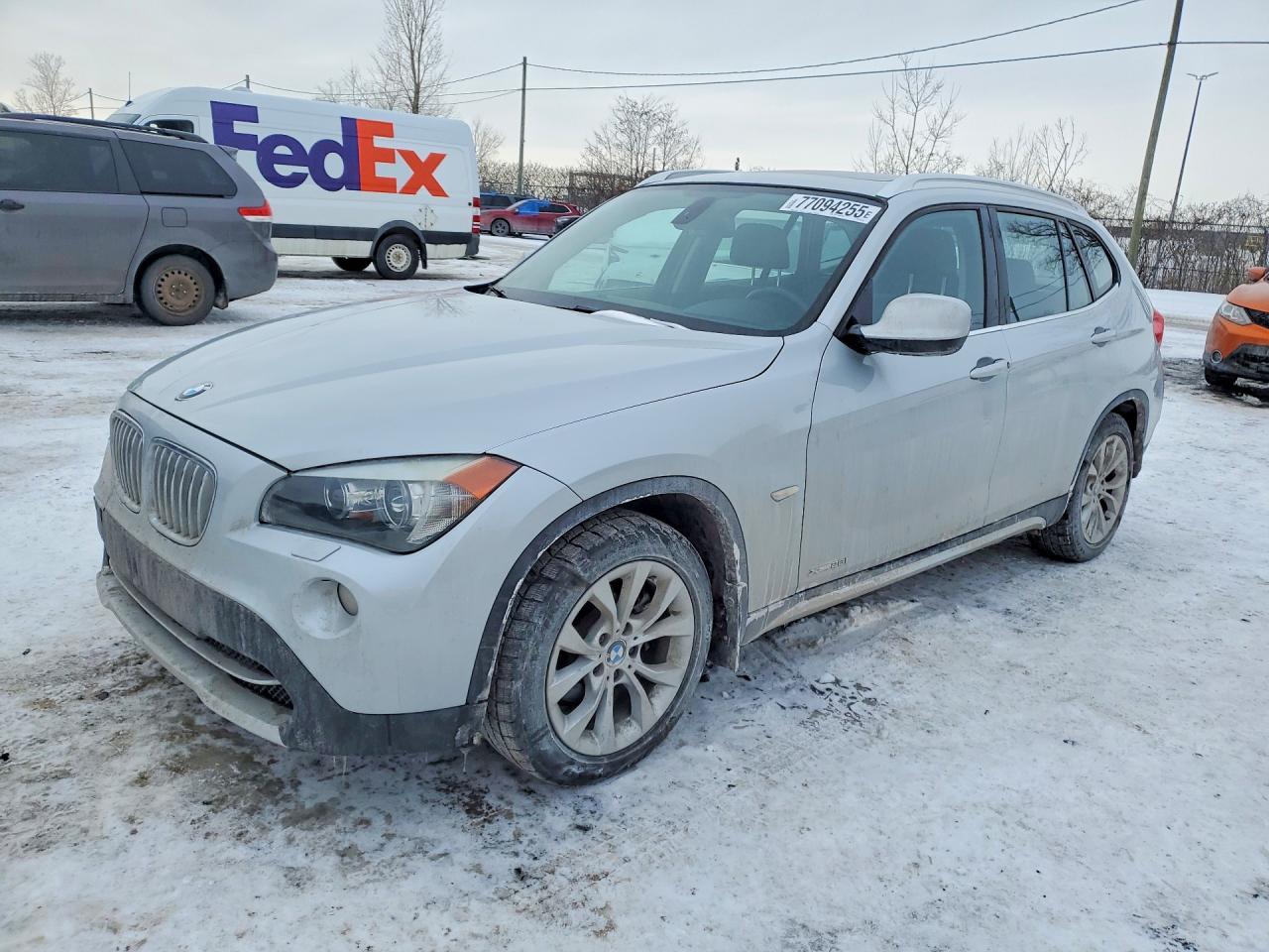 2012 BMW X1 28i, VIN WBAVL1C53CVR77924 — Front end