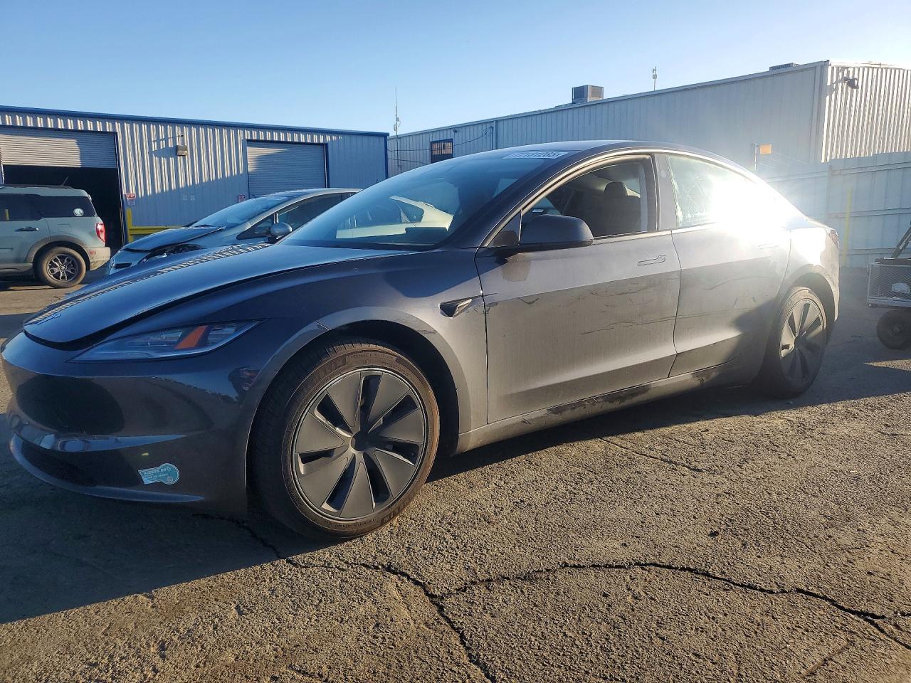2025 Tesla Model 3 Long Range, VIN 5YJ3E1EA2SF013696 — Rear end