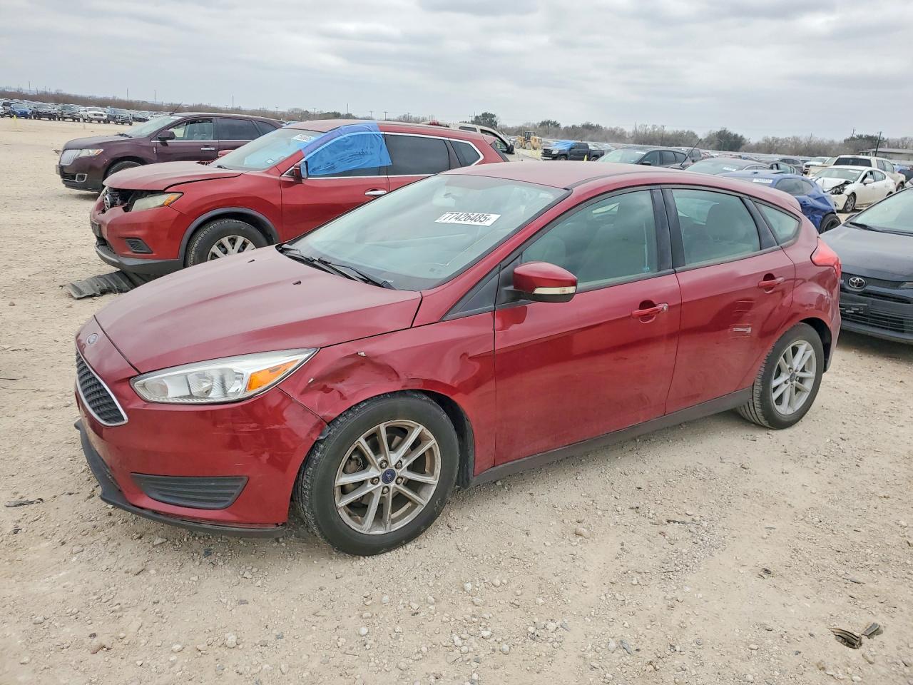 2015 Ford Focus SE, VIN 1FADP3K28FL313596 — Side