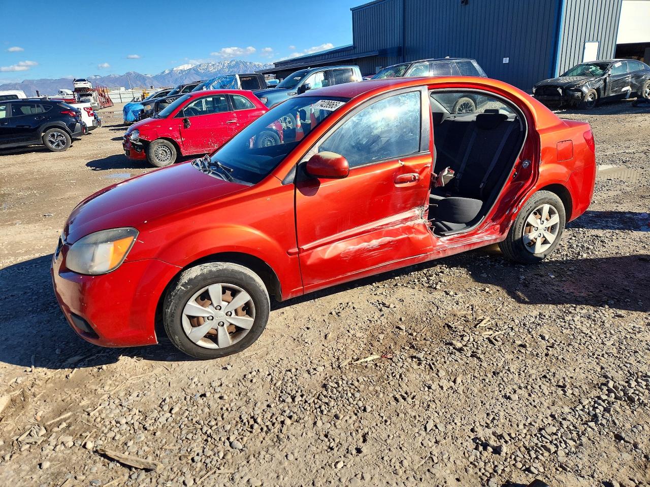 2011 Kia Rio LX, VIN KNADH4A32B6864751 — Бок