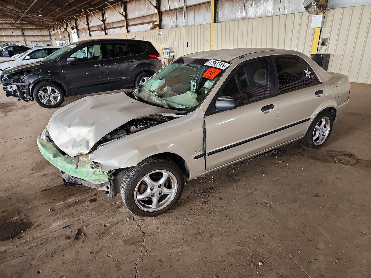 2000 Mazda Protege DX, VIN JM1BJ222XY0307526 — Front end