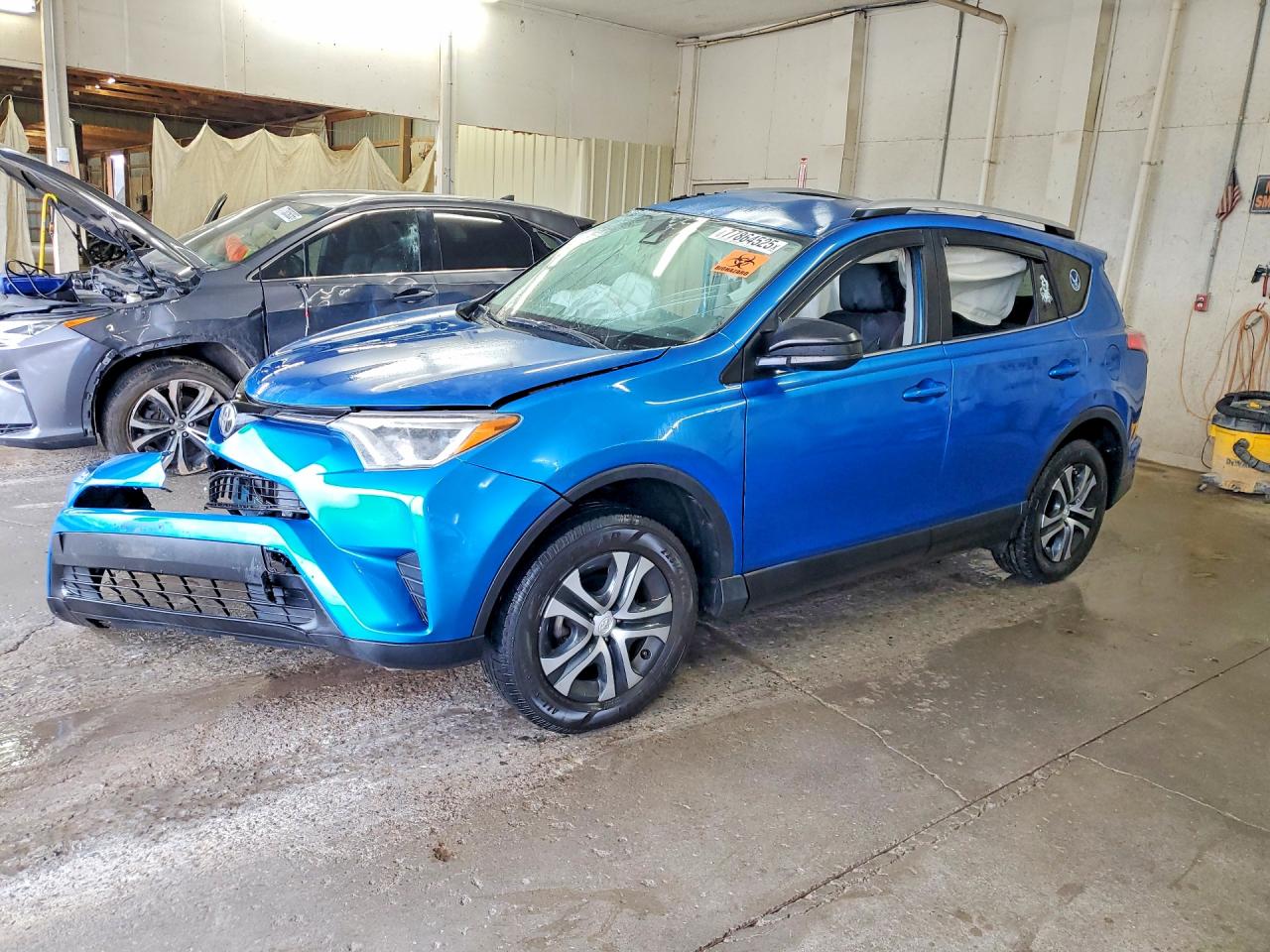 2017 Toyota RAV4 LE, VIN JTMZFREV9HJ710650 — Side