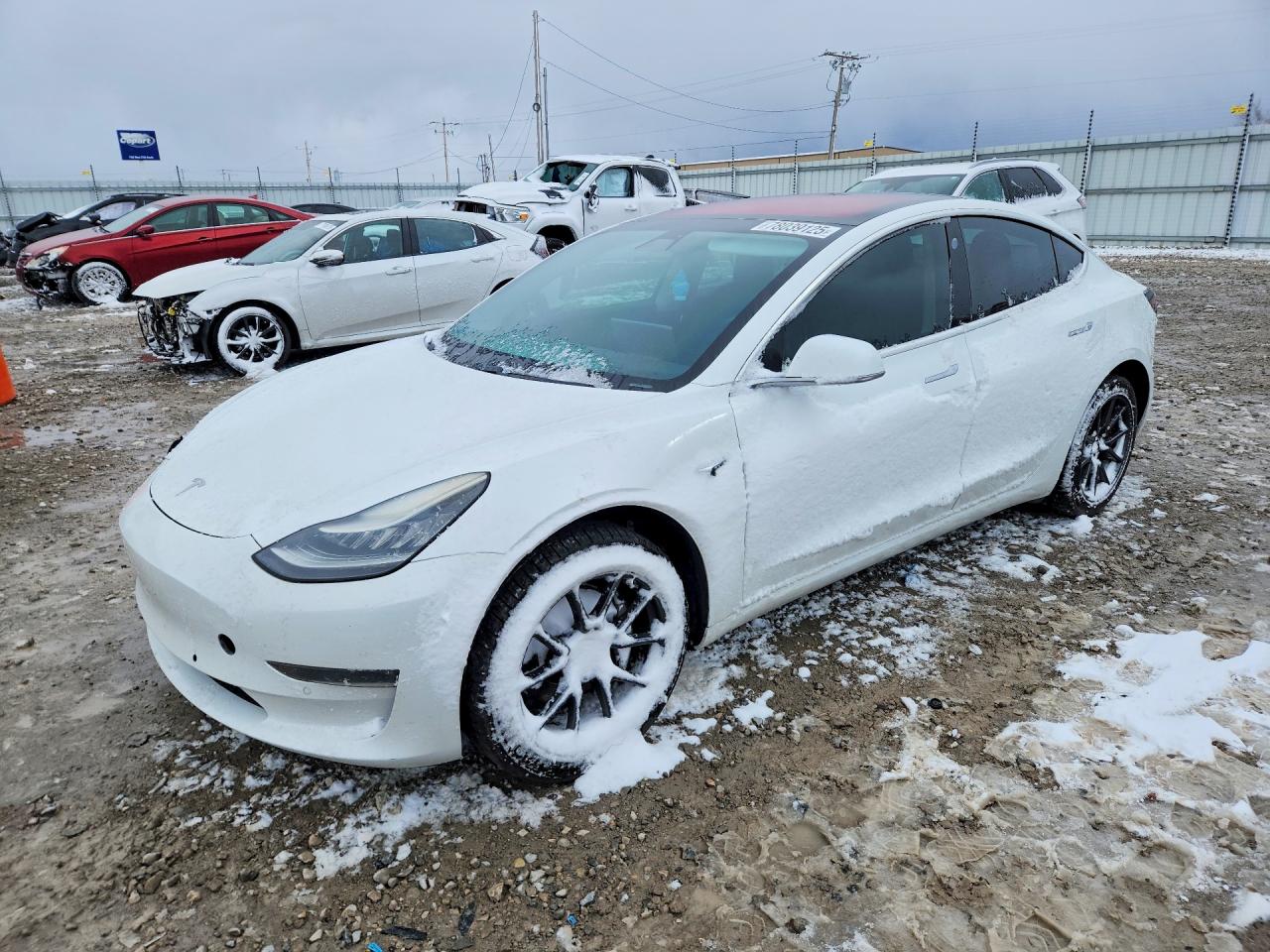 2017 Tesla Model 3 Standard, VIN 5YJ3E1EA4HF001543 — Бок