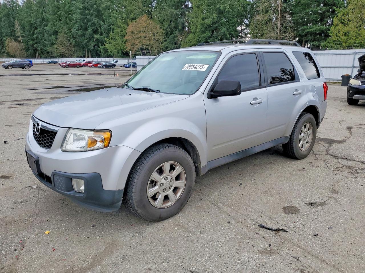 2011 Mazda Tribute Touring, VIN 4F2CY9C76BKM06892 — Бок