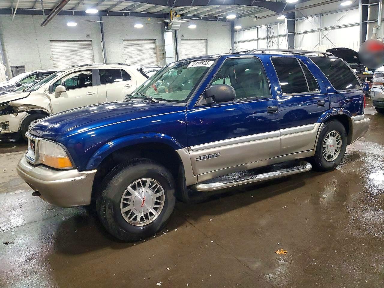 2001 GMC Jimmy SLE, VIN 1GKDT13W012128036 — Зад