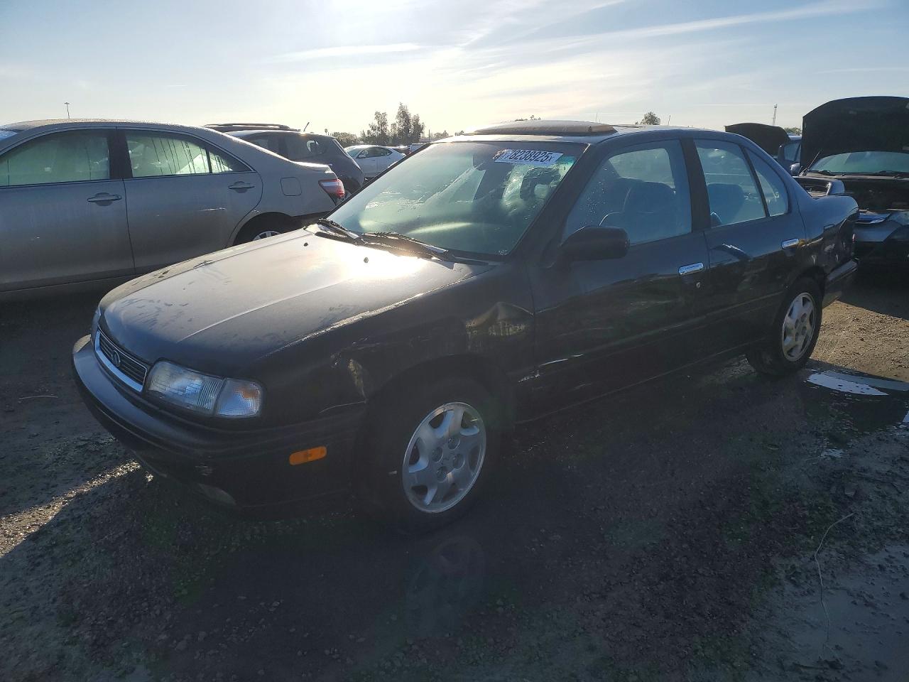 1996 Infiniti G20, VIN JNKCP01D8TT543138 — Side