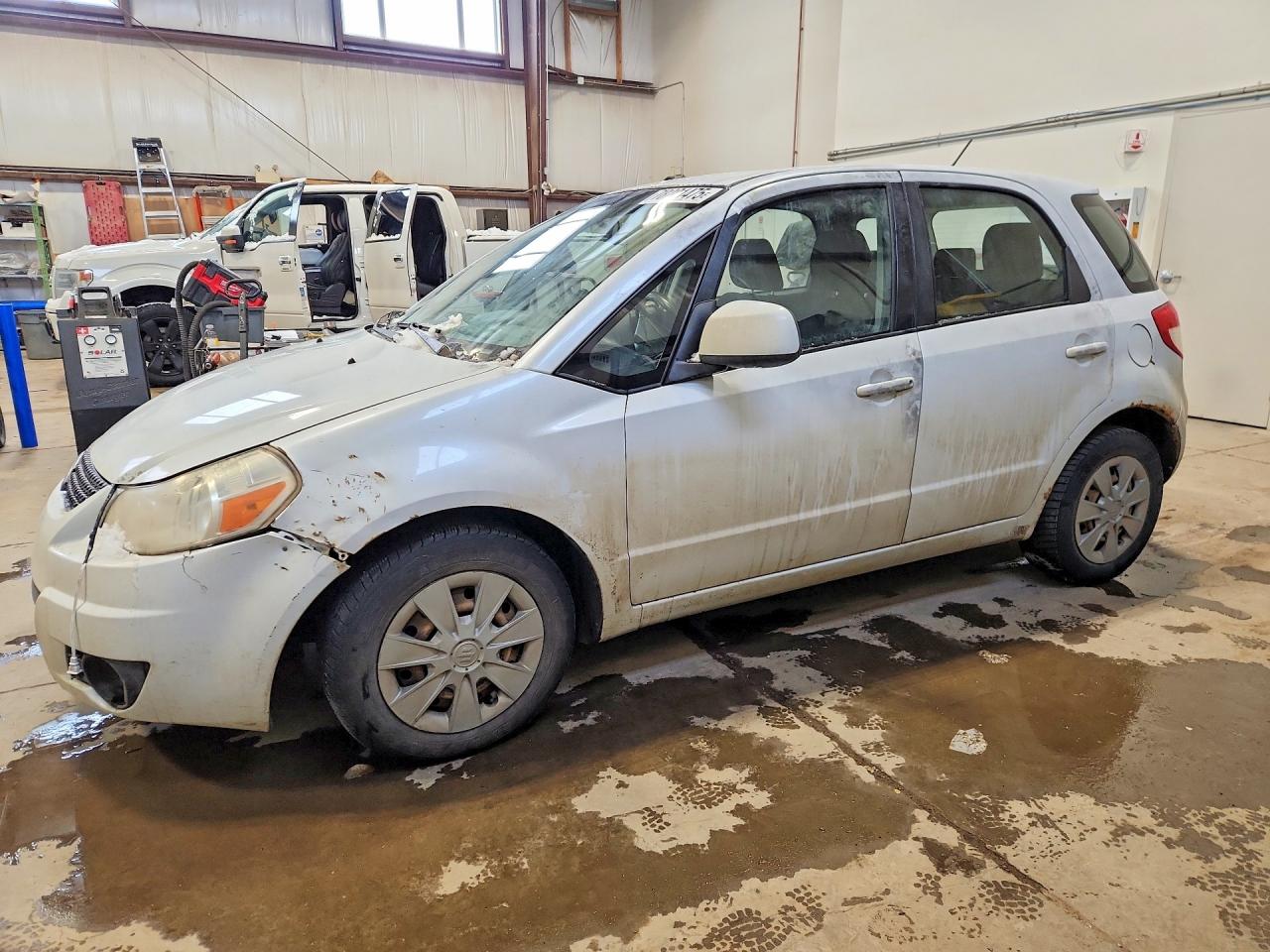 2011 Suzuki SX4, VIN JS2YA5A1XB6300476 — Vandalism