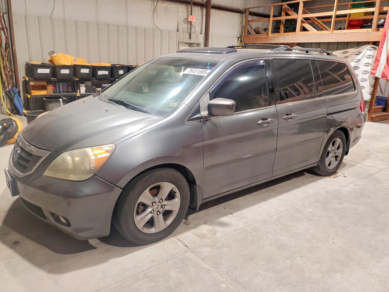2010 Honda Odyssey Touring, VIN 5FNRL3H96AB017701 — Prior damage history
