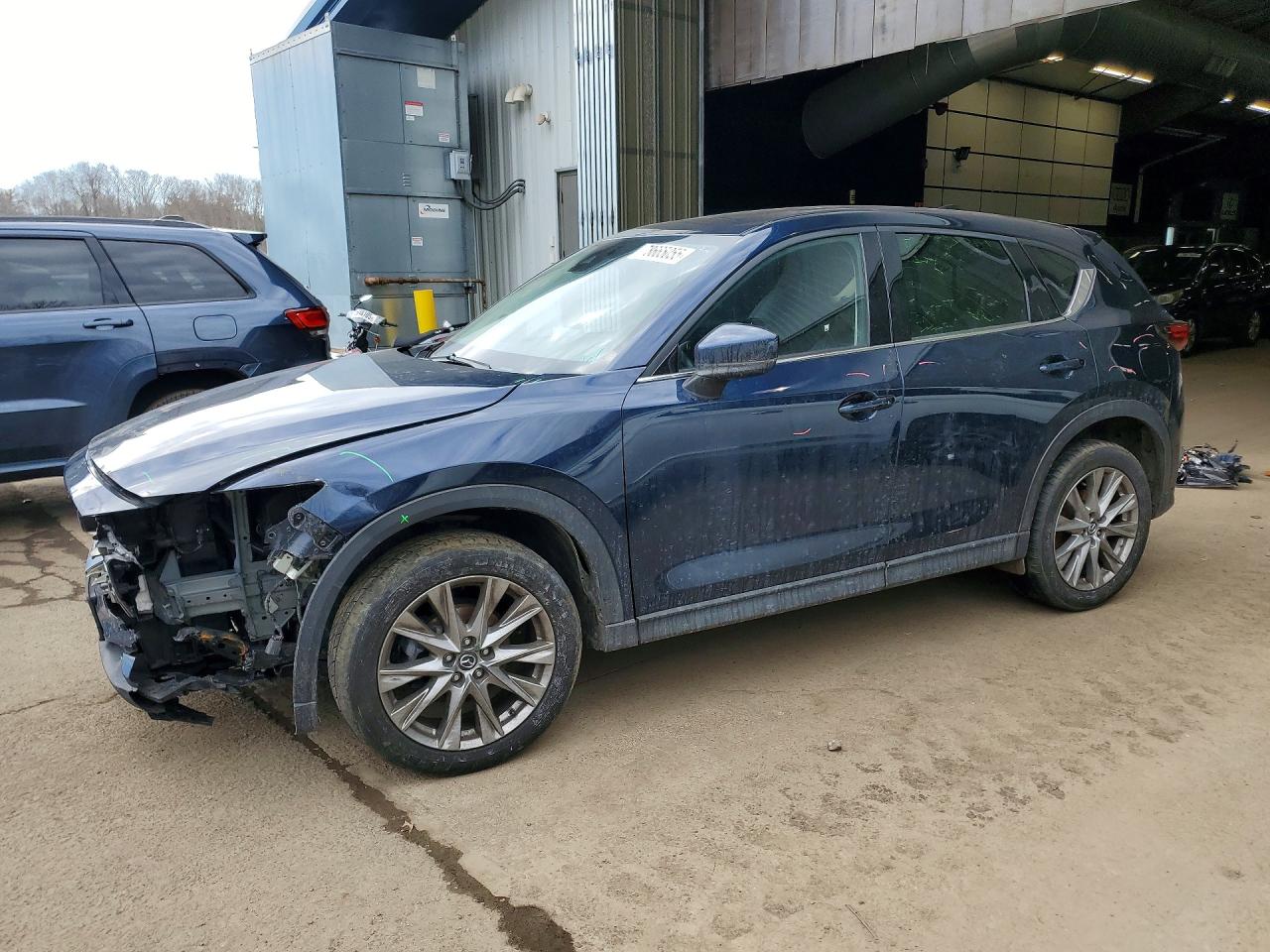 2021 Mazda CX-5 Grand Touring, VIN JM3KFBDM7M1496700 — Front end