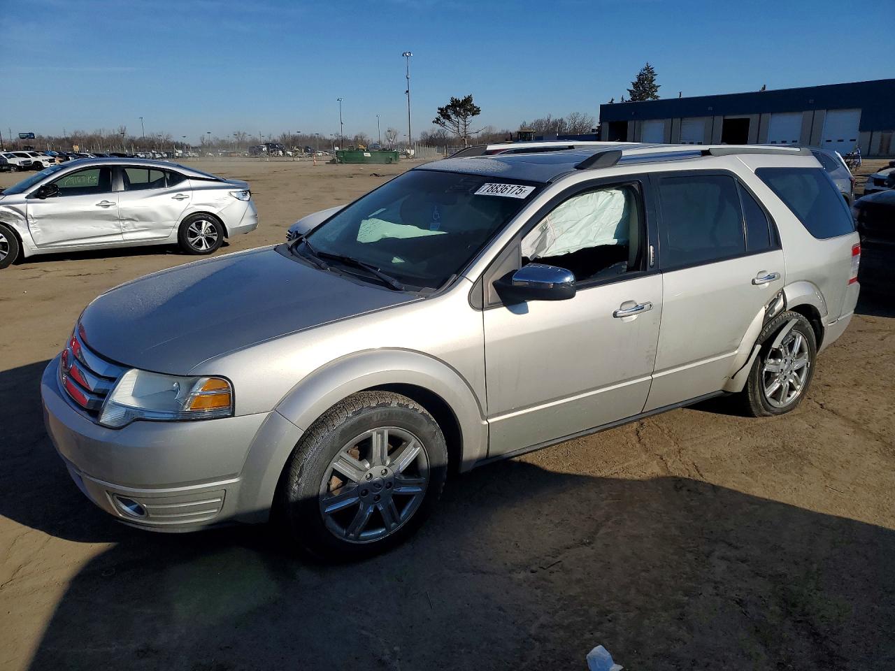 2008 Ford Taurus X Limited, VIN 1FMDK06W58GA40449 — Side