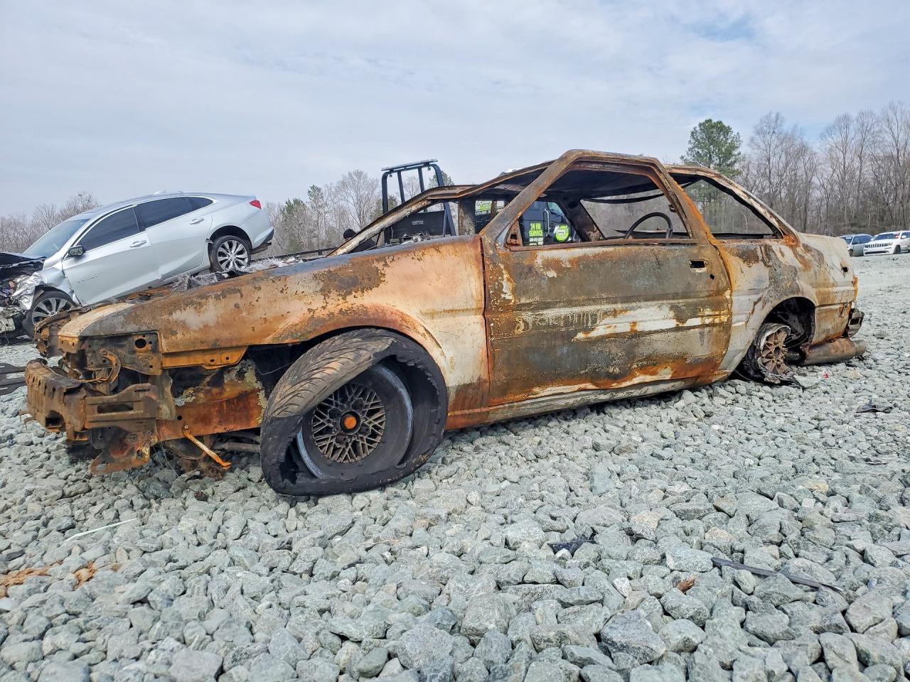 1987 Toyota Corolla, VIN JT2AE86S5H0284968 — Burn