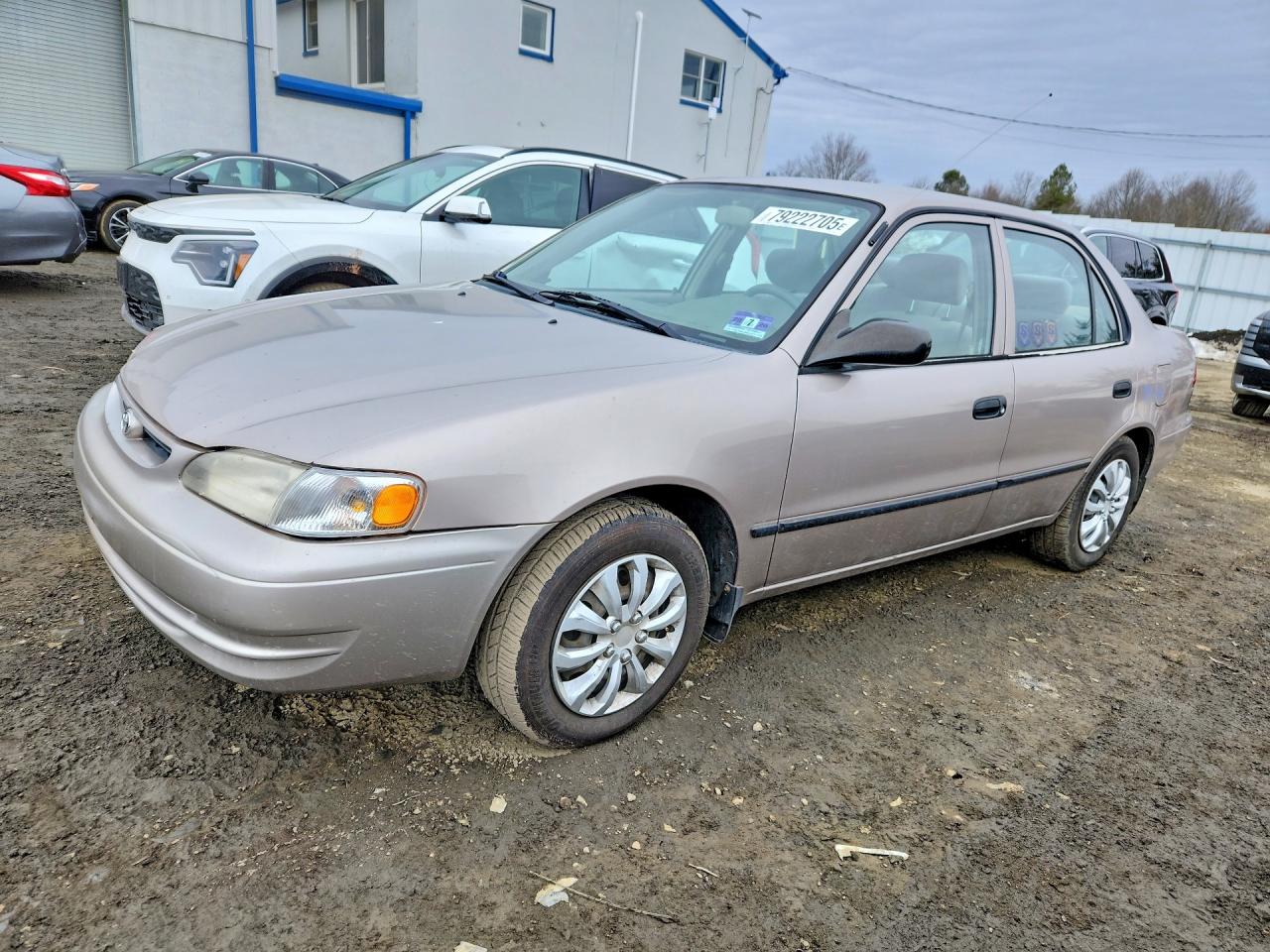 2000 Toyota Corolla CE, VIN 2T1BR12E0YC366071 — Side