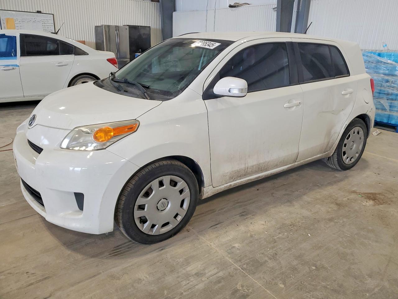 2010 Scion xD, VIN JTKKU4B40A1002968 — Side