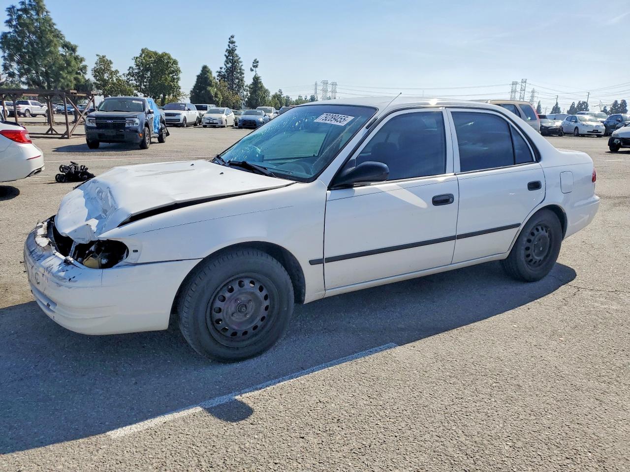 2000 Toyota Corolla CE, VIN 1NXBR12E8YZ346245 — Front end