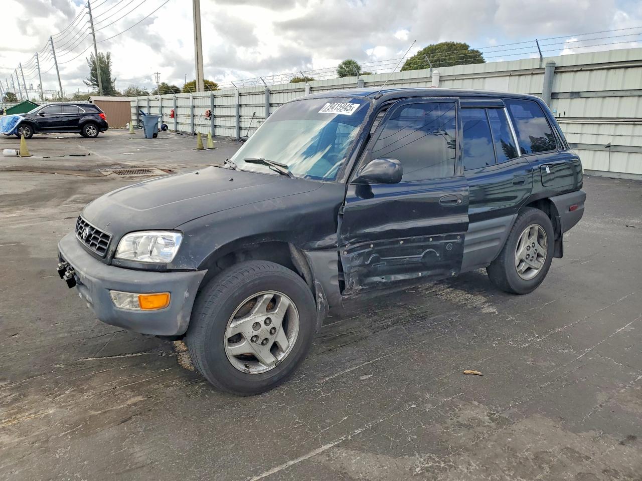 1998 Toyota RAV4, VIN JT3HP10V7W7101346 — Side