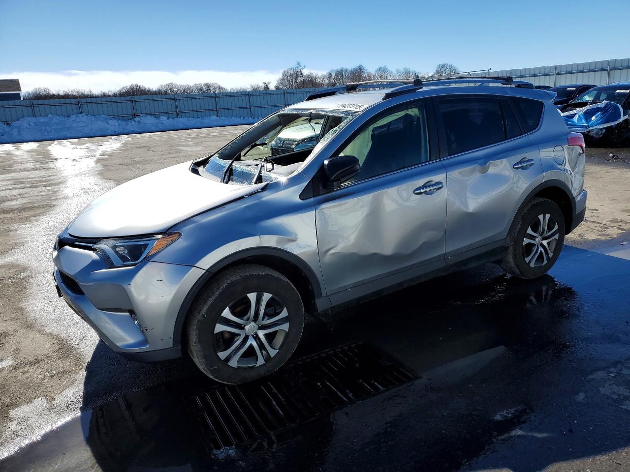 2018 Toyota RAV4 LE, VIN JTMBFREV5JJ221086 — Side