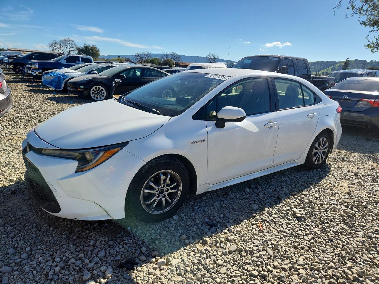 2021 Toyota Corolla Hybrid LE, VIN JTDEAMDE6MJ018938 — Side