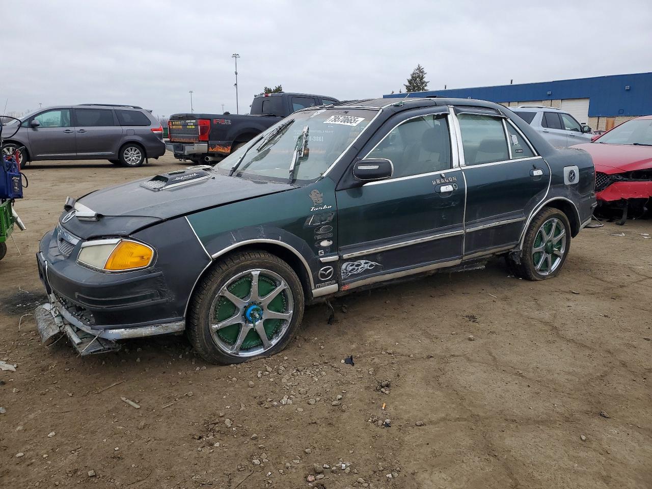 2000 Mazda Protege DX, VIN JM1BJ2229Y0254253 — Side