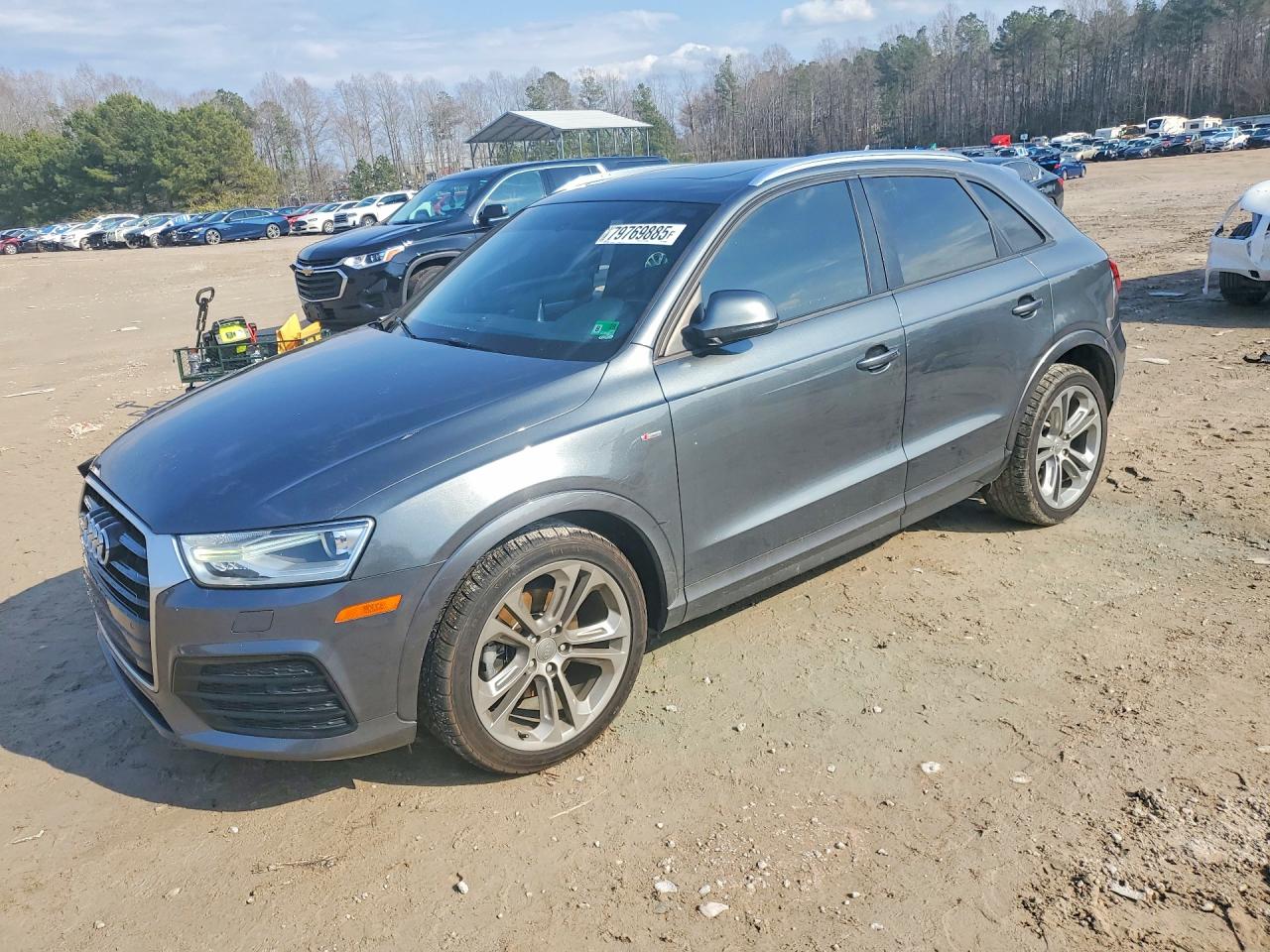 2018 Audi Q3 Premium, VIN WA1BCCFS0JR013459 — Side