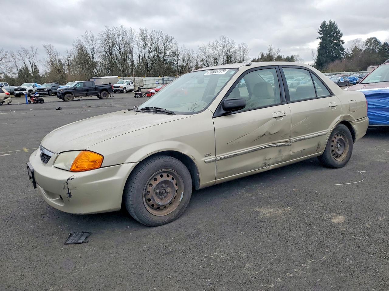 2000 Mazda Protege DX, VIN JM1BJ2223Y0275387 — Side