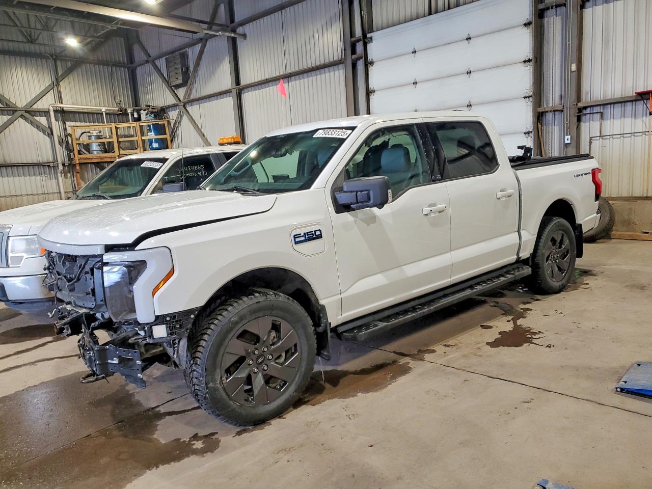 2025 Ford F-150 Lightning Flash, VIN 1FT6W3LU9SWG13825 — Front end
