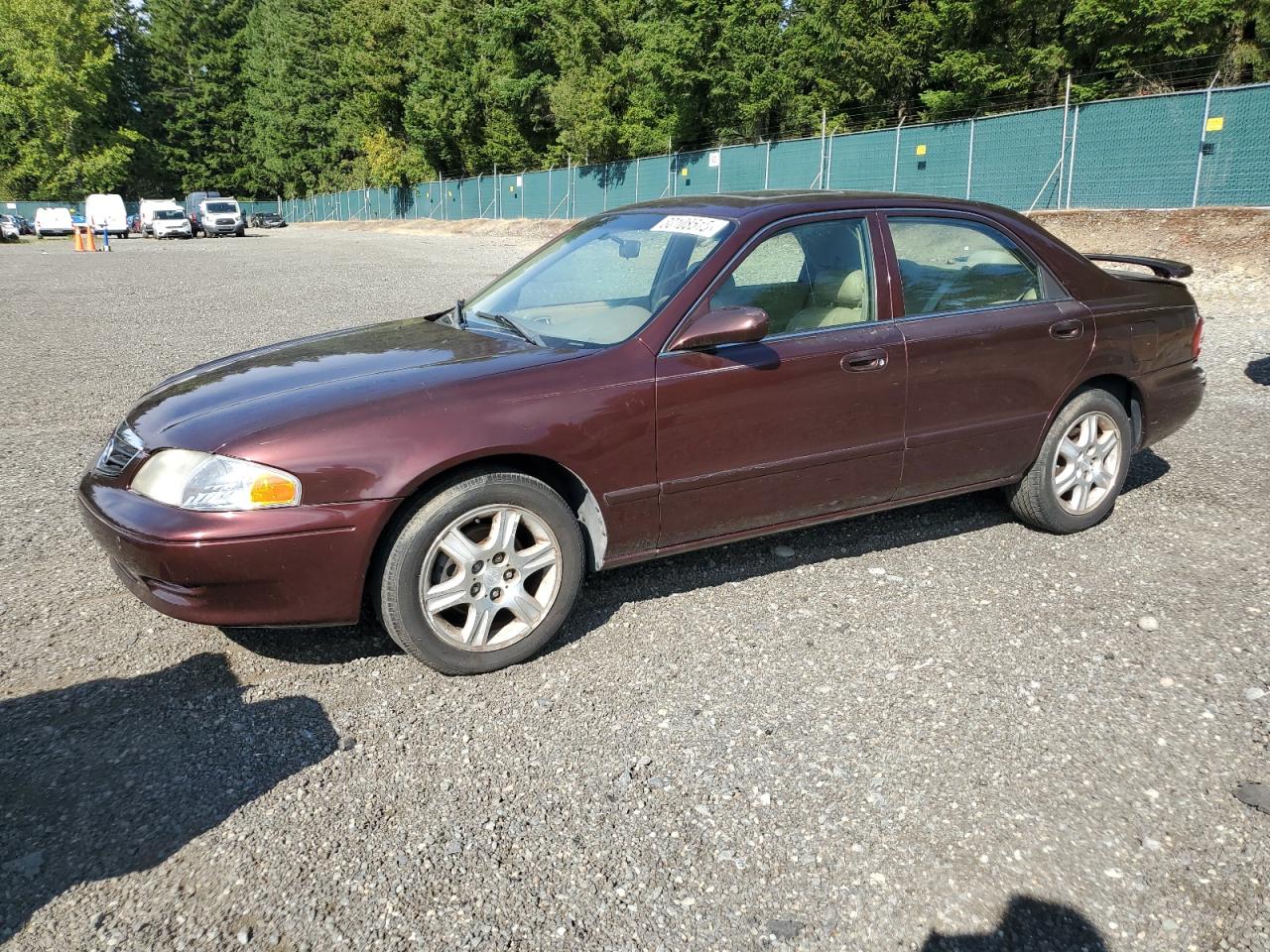 2000 Mazda 626 LX, VIN 1YVGF22D9Y5155079 — Minor dents and scratches