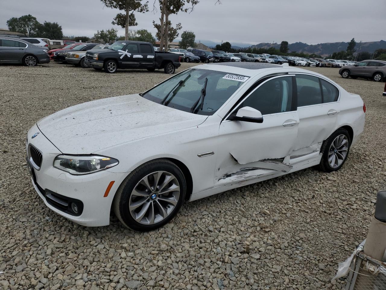 2016 BMW 5 Series 528i, VIN WBA5A5C55GG355218 — Side