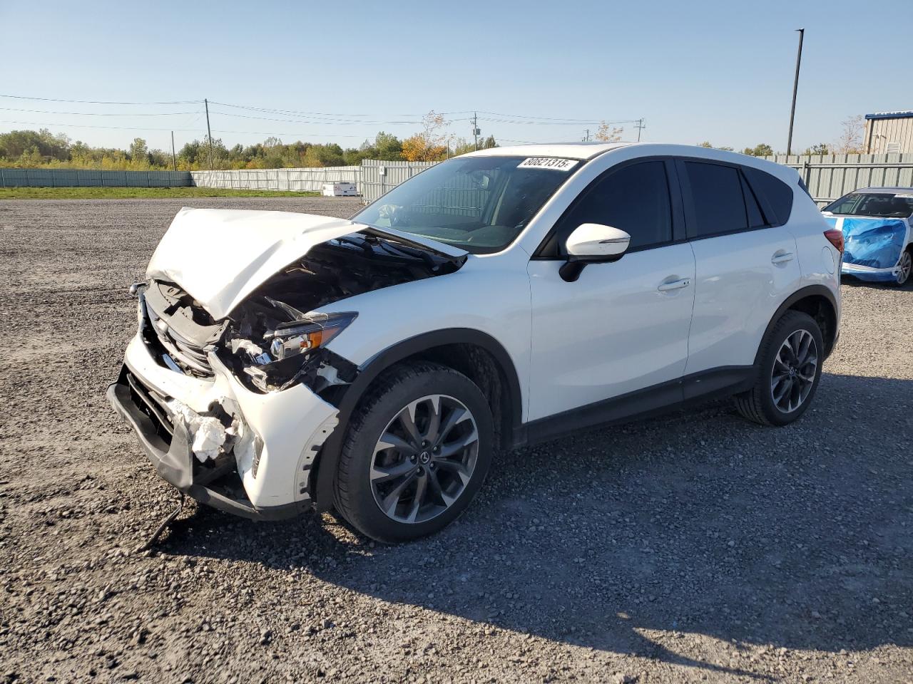 2016 Mazda CX-5 Grand Touring, VIN JM3KE4DY3G0731072 — Front end