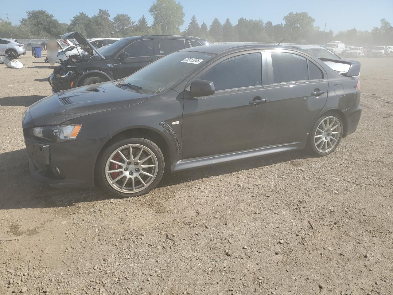 2013 Mitsubishi Lancer Evolution GSR, VIN JA32W8FV5DU011095 — Side