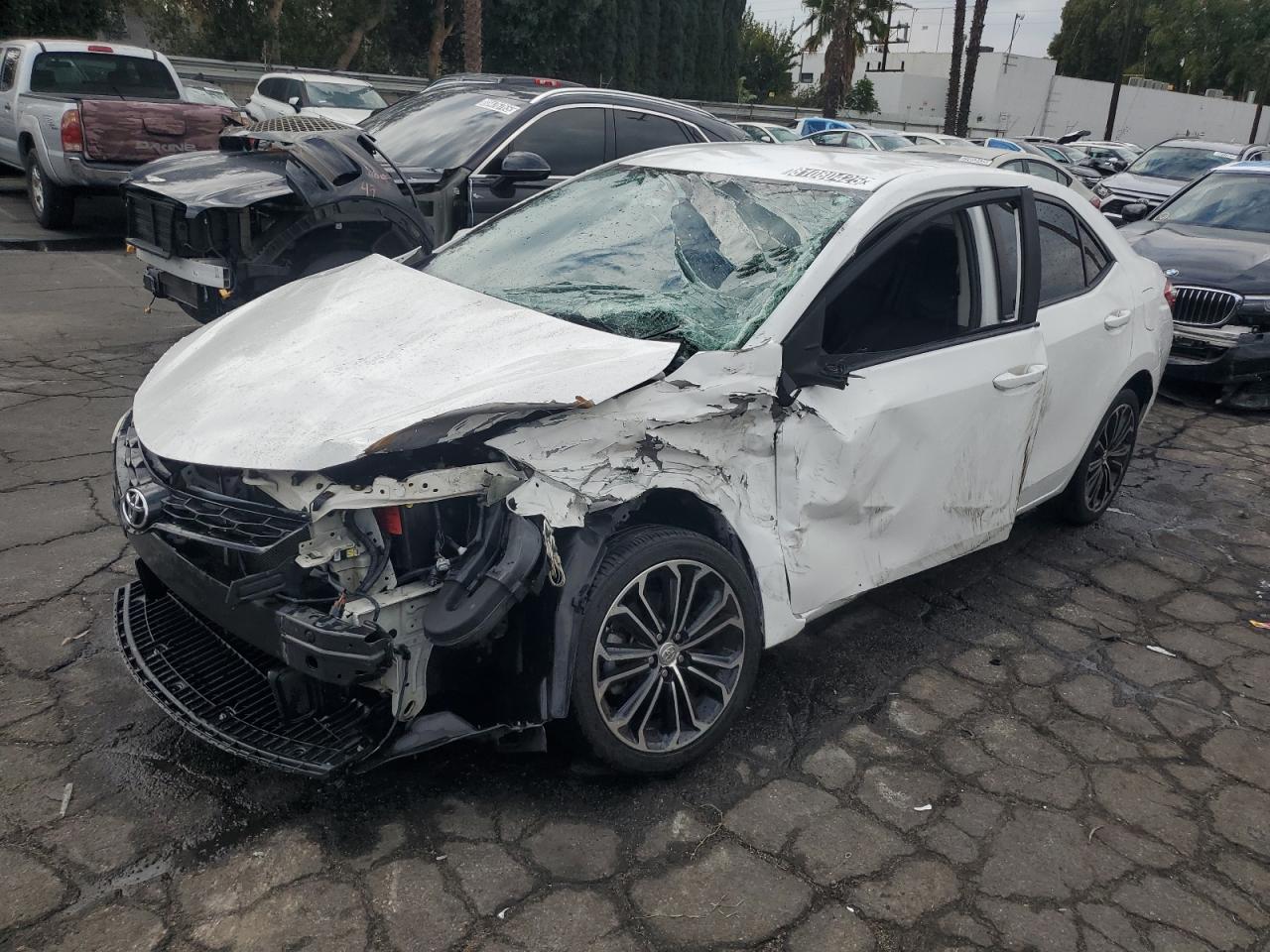 2016 Toyota Corolla L, VIN 5YFBURHE2GP419811 — Front end