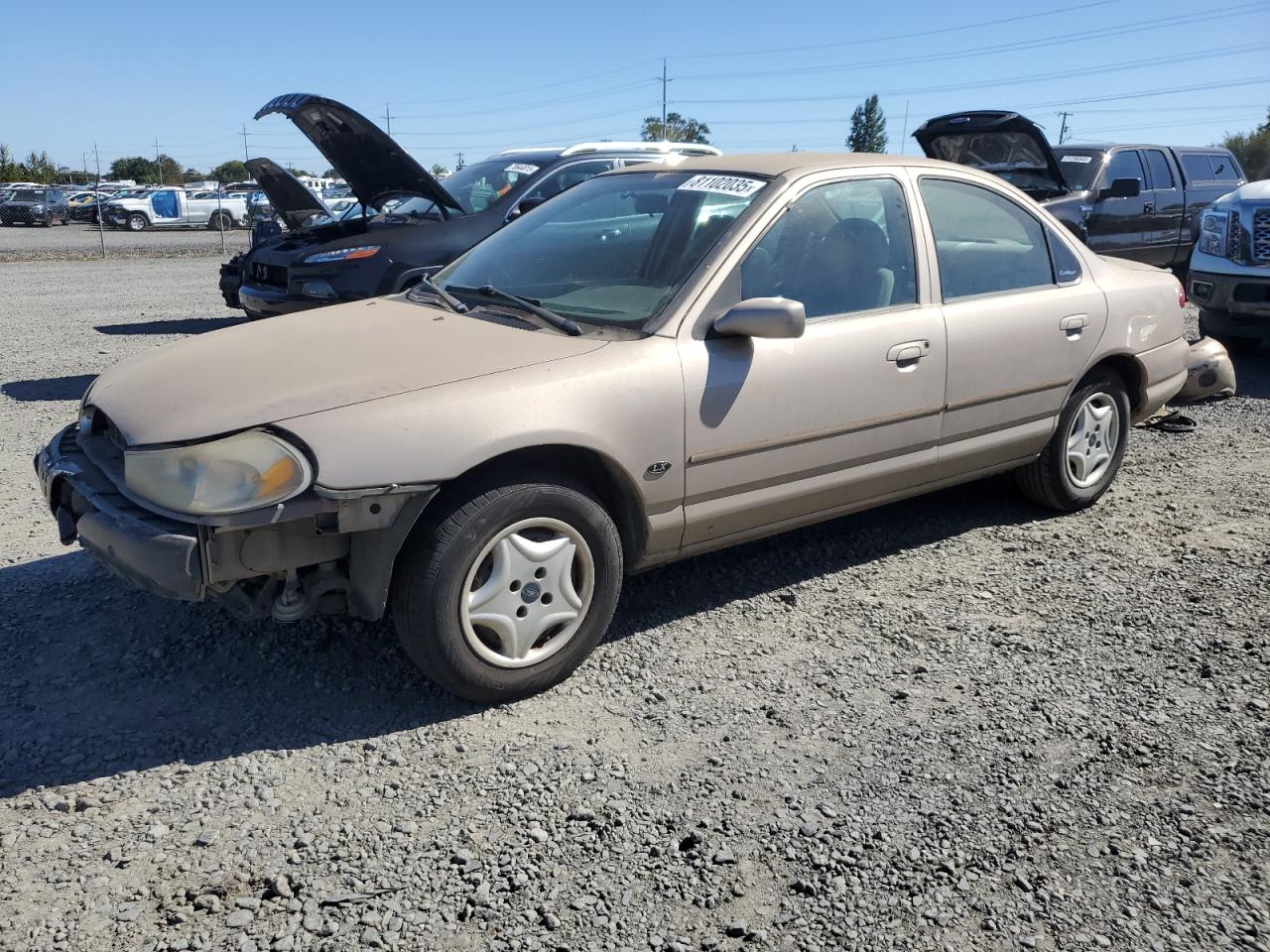 1999 Ford Contour LX, VIN 1FAFP6537XK201071 — Front end