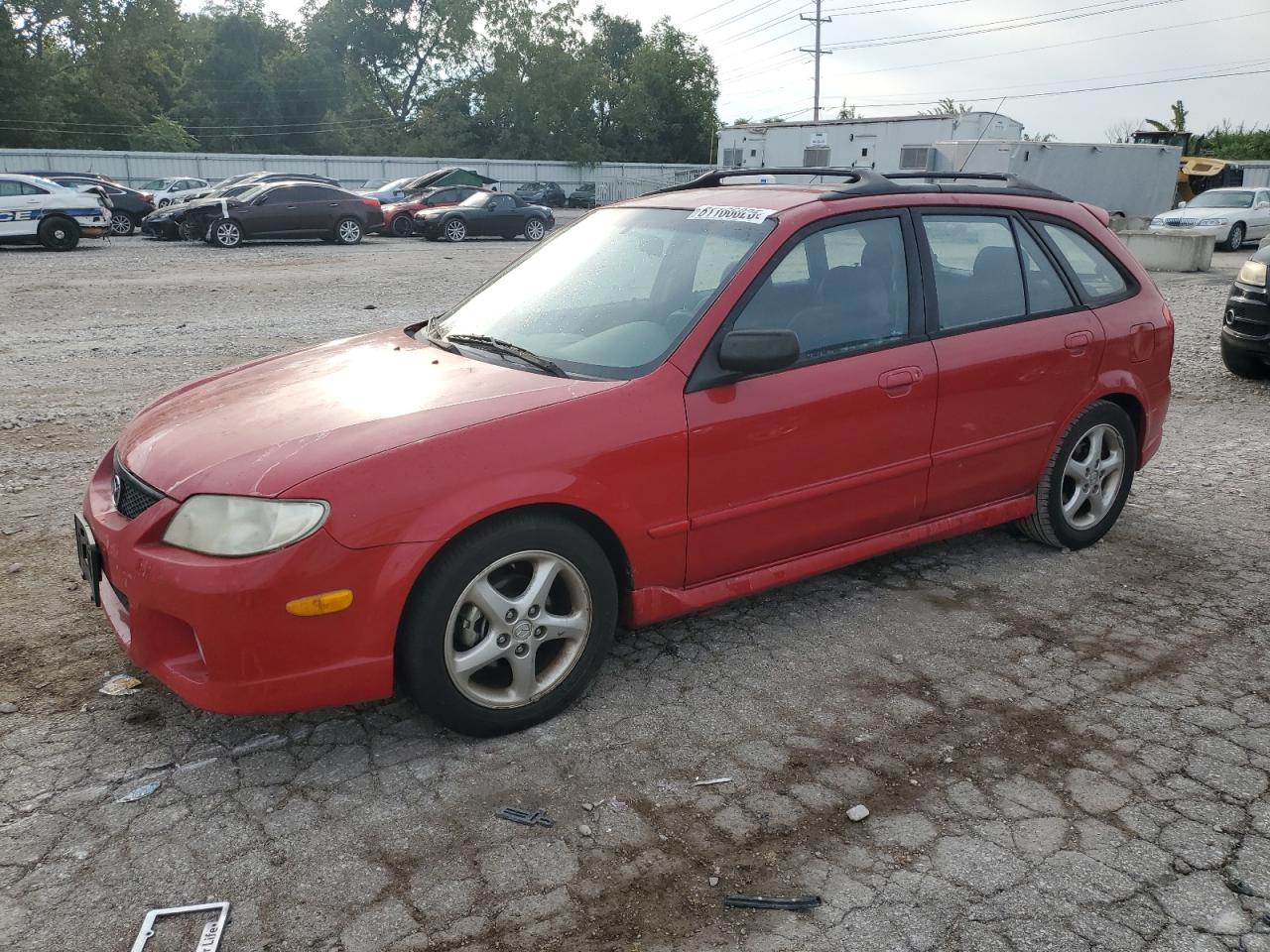 2002 Mazda Protege, VIN JM1BJ245X21473618 — Side