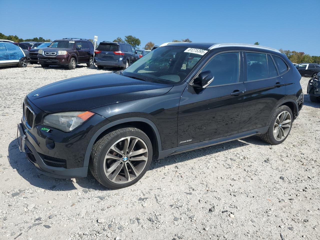 2015 BMW X1 xDrive28i, VIN WBAVL1C59FVY39616 — Rear end