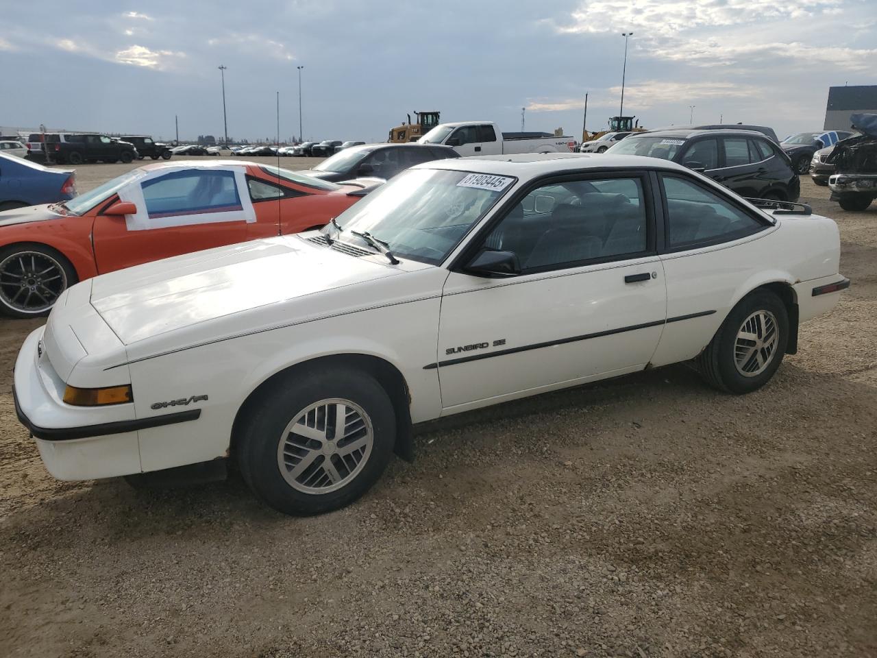 1988 Pontiac Sunbird, VIN 1G2JD11K5J7579014 — Minor dents and scratches