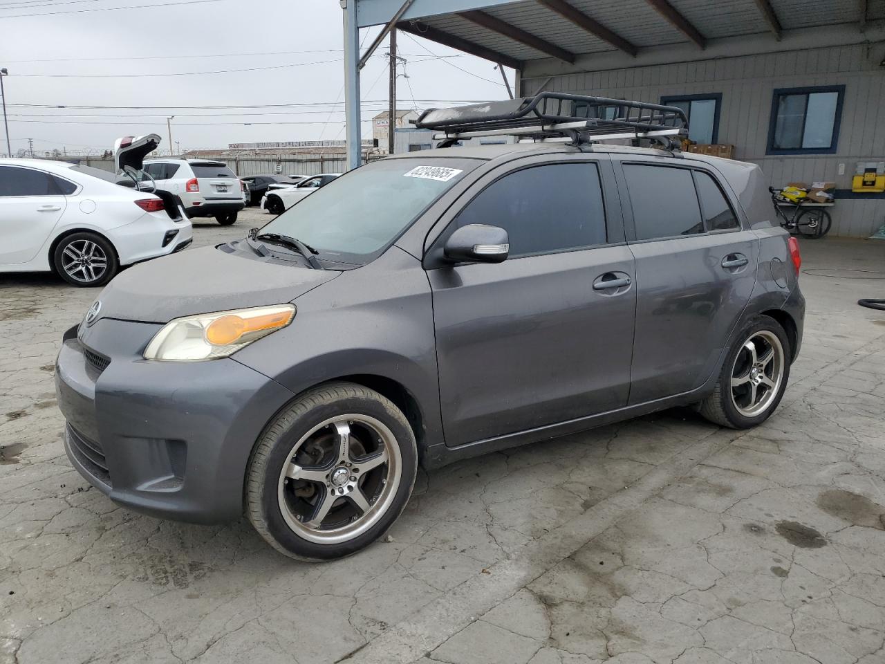 2010 Scion xD, VIN JTKKU4B49AJ058181 — Side