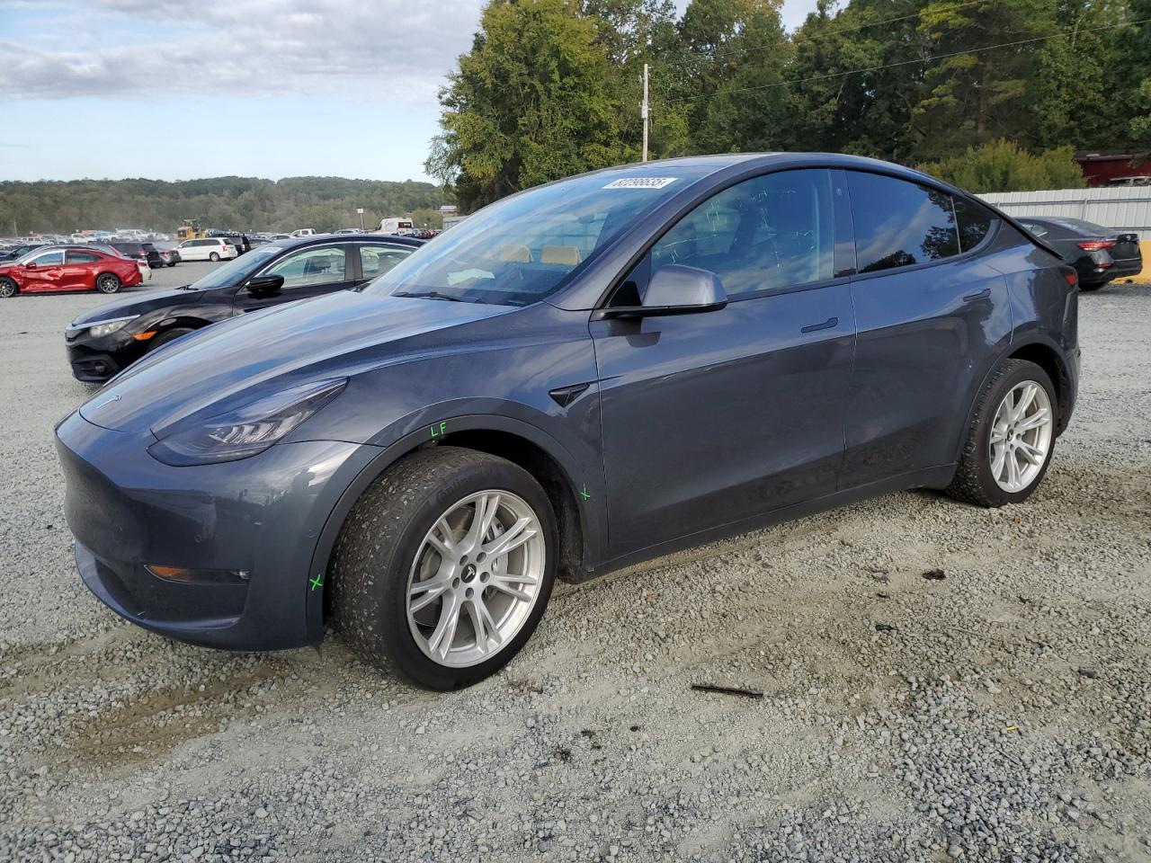 2021 Tesla Model Y Long Range, VIN 5YJYGDEE9MF294015 — Side